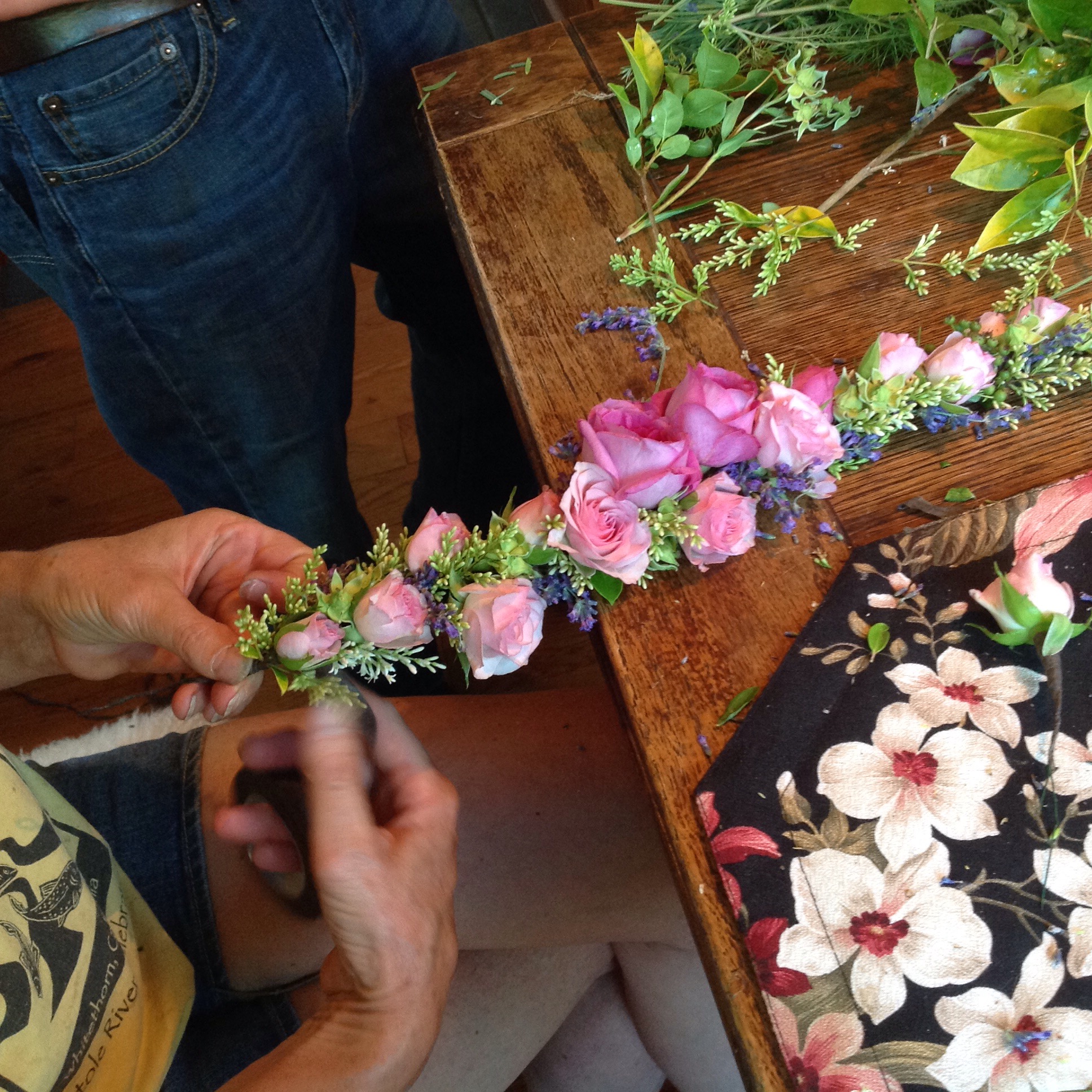 Designer making a crown of roses