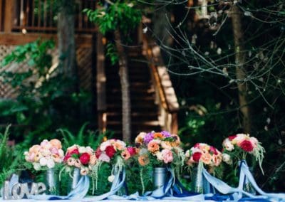 Colorful bouquets with blue ribbons and "love" sign.