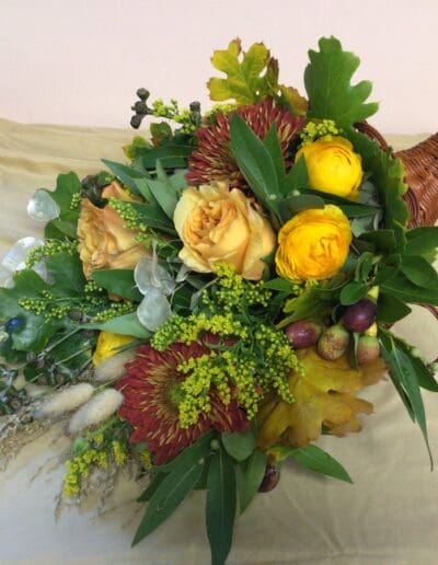 Fall flower arrangement in a cornucopia.