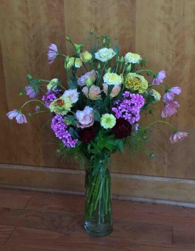 Garden Delight features our own farm grown Lisianthis arranged with the freshest blooms of the day in an elegant recycled glass vase. $90.00