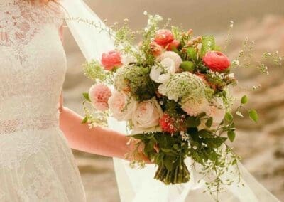 Bride holding a floral bouquet.