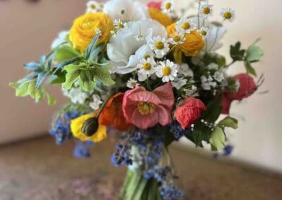 Colorful bouquet with daisies and poppies.